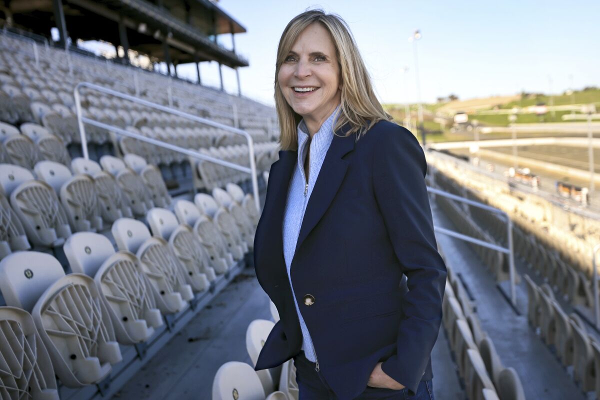 Jill Gregory, executive vice president and general manager of Sonoma Raceway, poses on Dec. 10, 2021, near Sonoma, Calif. Gregory, a Modesto native and graduate of California Polytechnic State, returned home in early 2021 to run Sonoma Raceway as the executive vice president and general manager of the picturesque road course in wine country. She'd had a longtime career with NASCAR, but couldn't pass the opportunity to go home and run Sonoma when the job opened. (Kent Porter/The Press Democrat via AP)