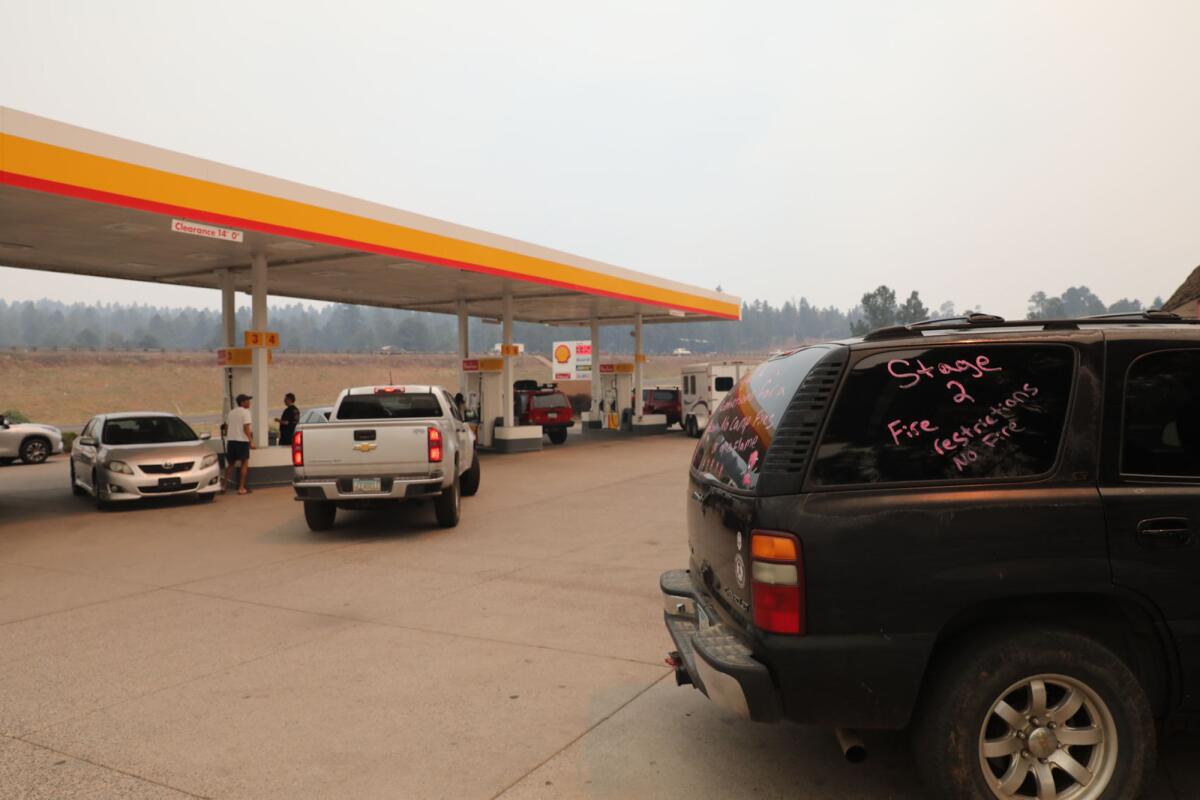 Smoke shrouds the skies in a small community south of Flagstaff, Arizona