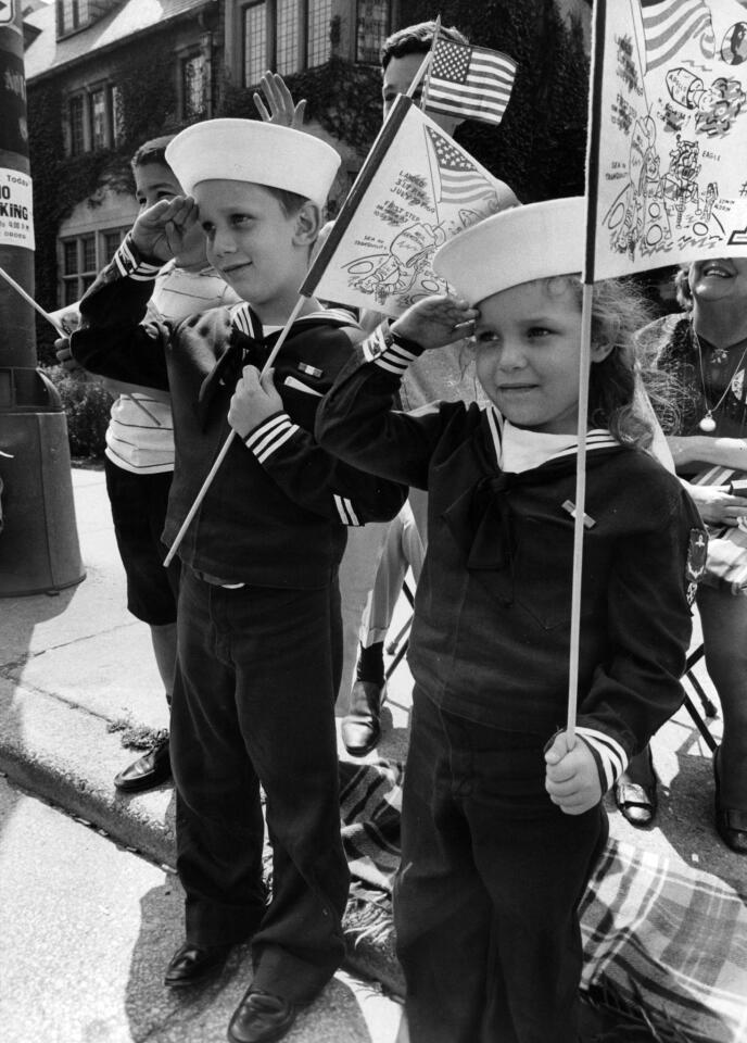 Youngsters in sailor suits salute Apollo 11 astronauts during the "Moon Men" parade at Oak Street and Michigan Avenue in Chicago on Aug. 13, 1969.