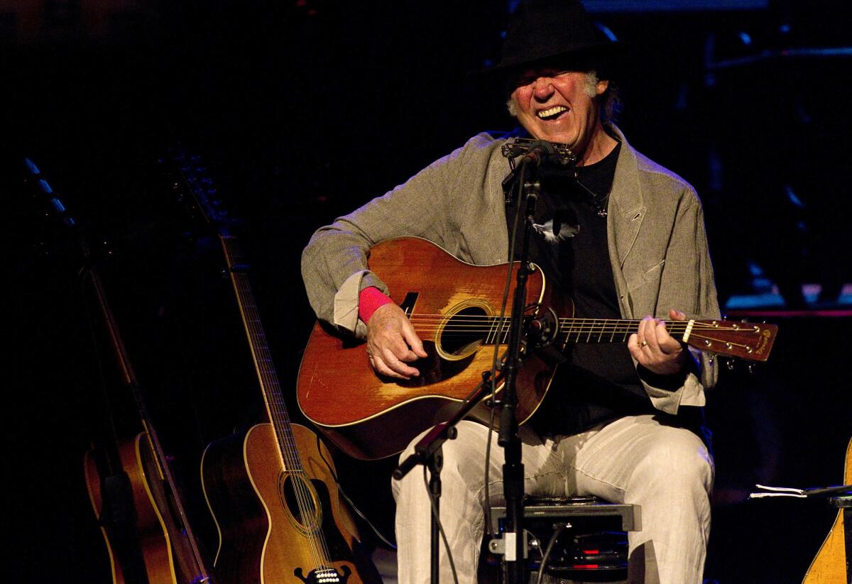 Neil Young performs onstage at the Dolby Theatre in Hollywood.