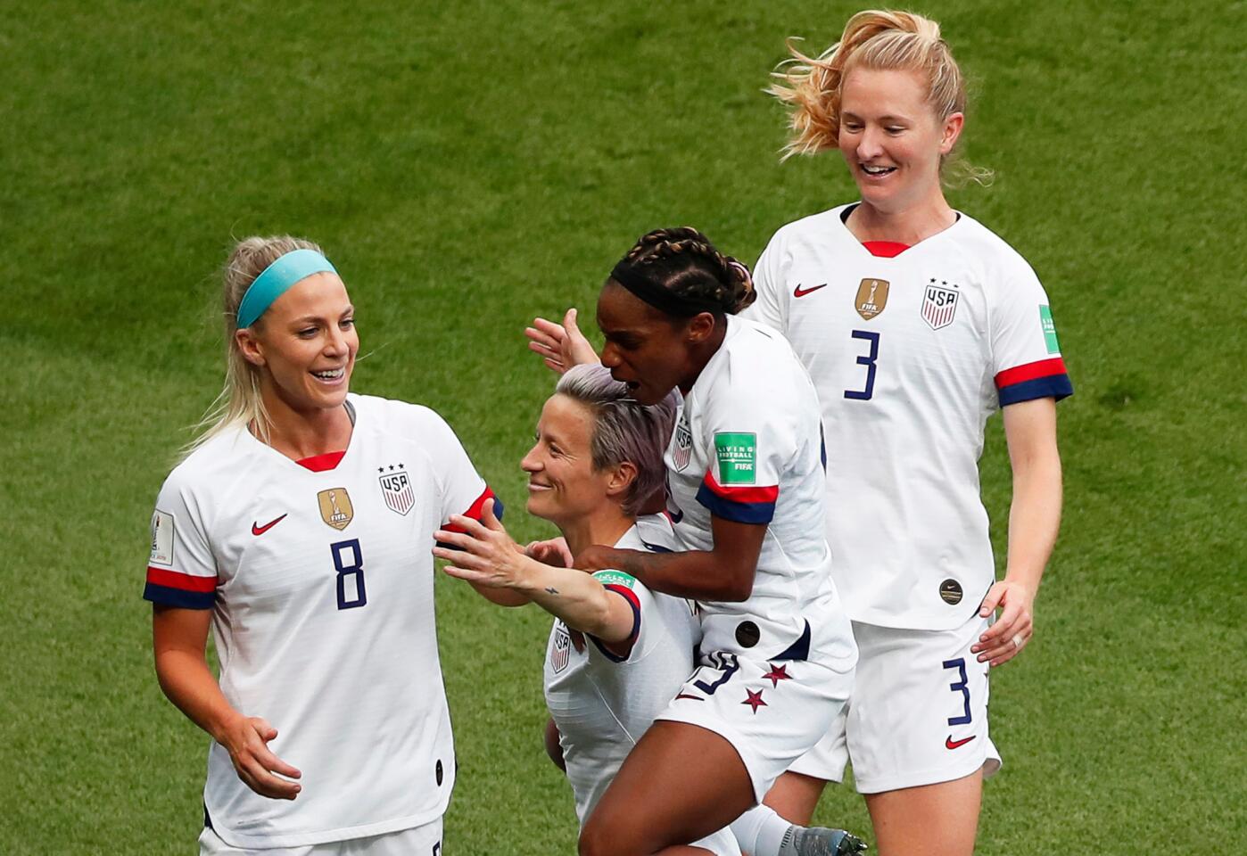 U.S. players celebrate with Megan Rapinoe