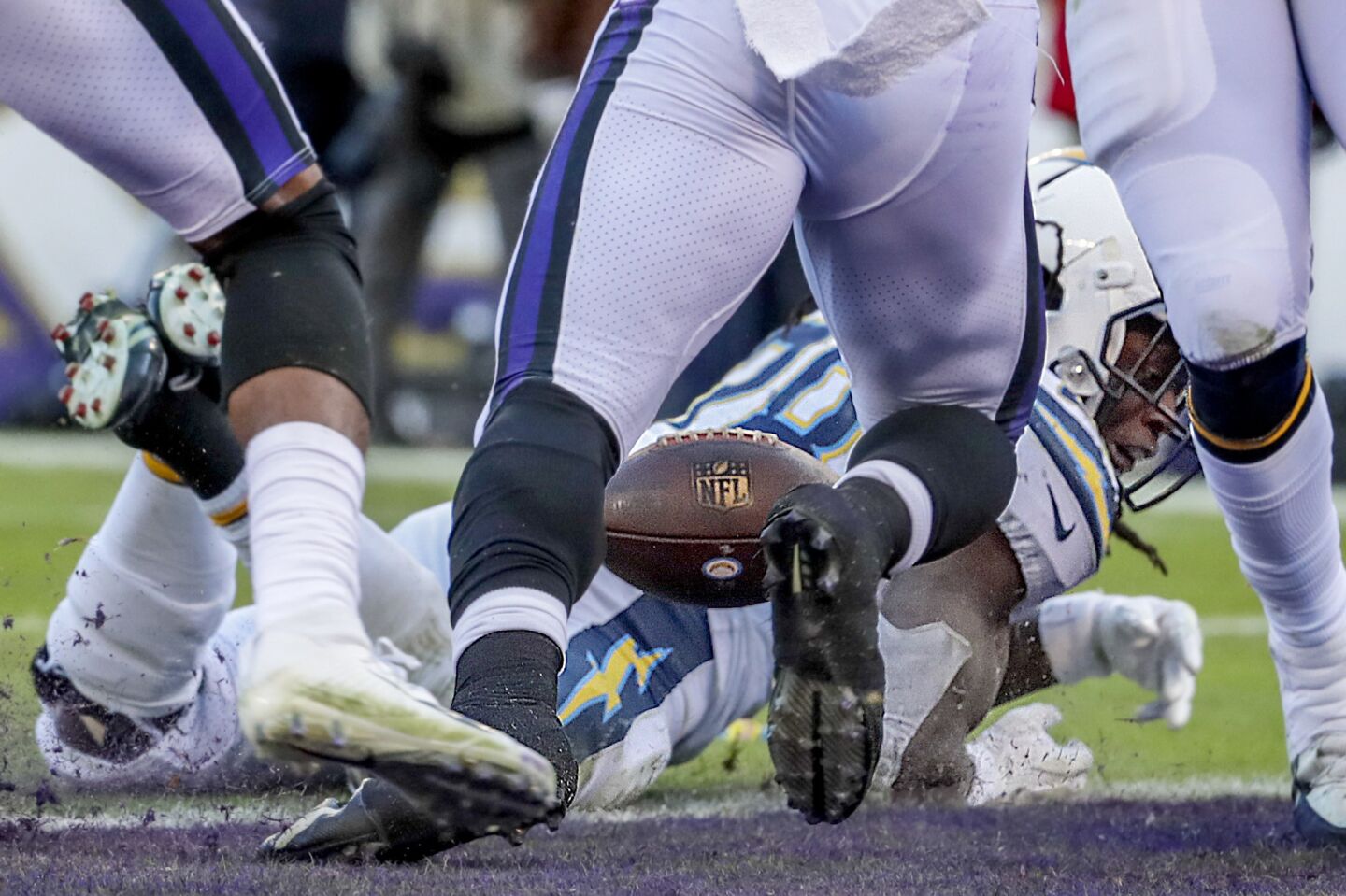 Chargers running back Melvin Gordon loses control of the ball as he dives for the endzone on a fourth-quarter drive. The play was marked just short of the goal line after a booth review.
