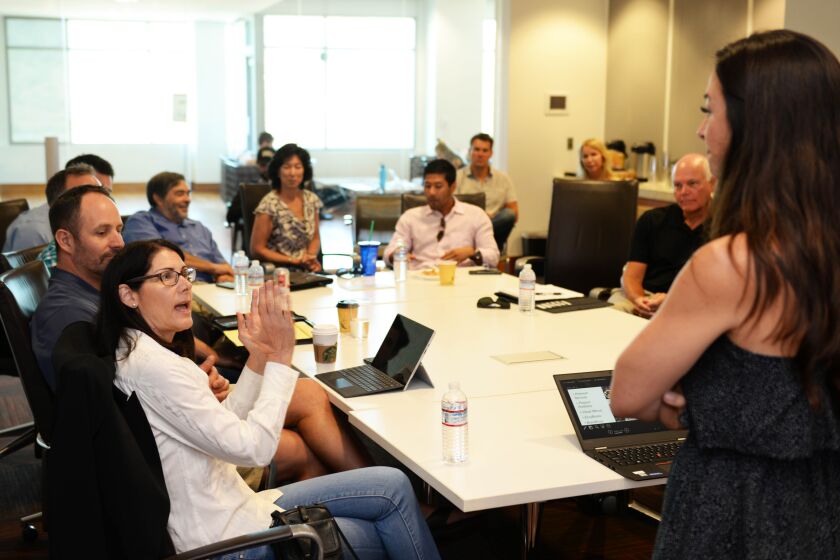 Investors at San Diego's chapter of Tech Coast Angels (TCA) discuss strategy and investments at a meeting. TCA led Atlazo's recent seed round in one of the angel group's biggest investments to date.