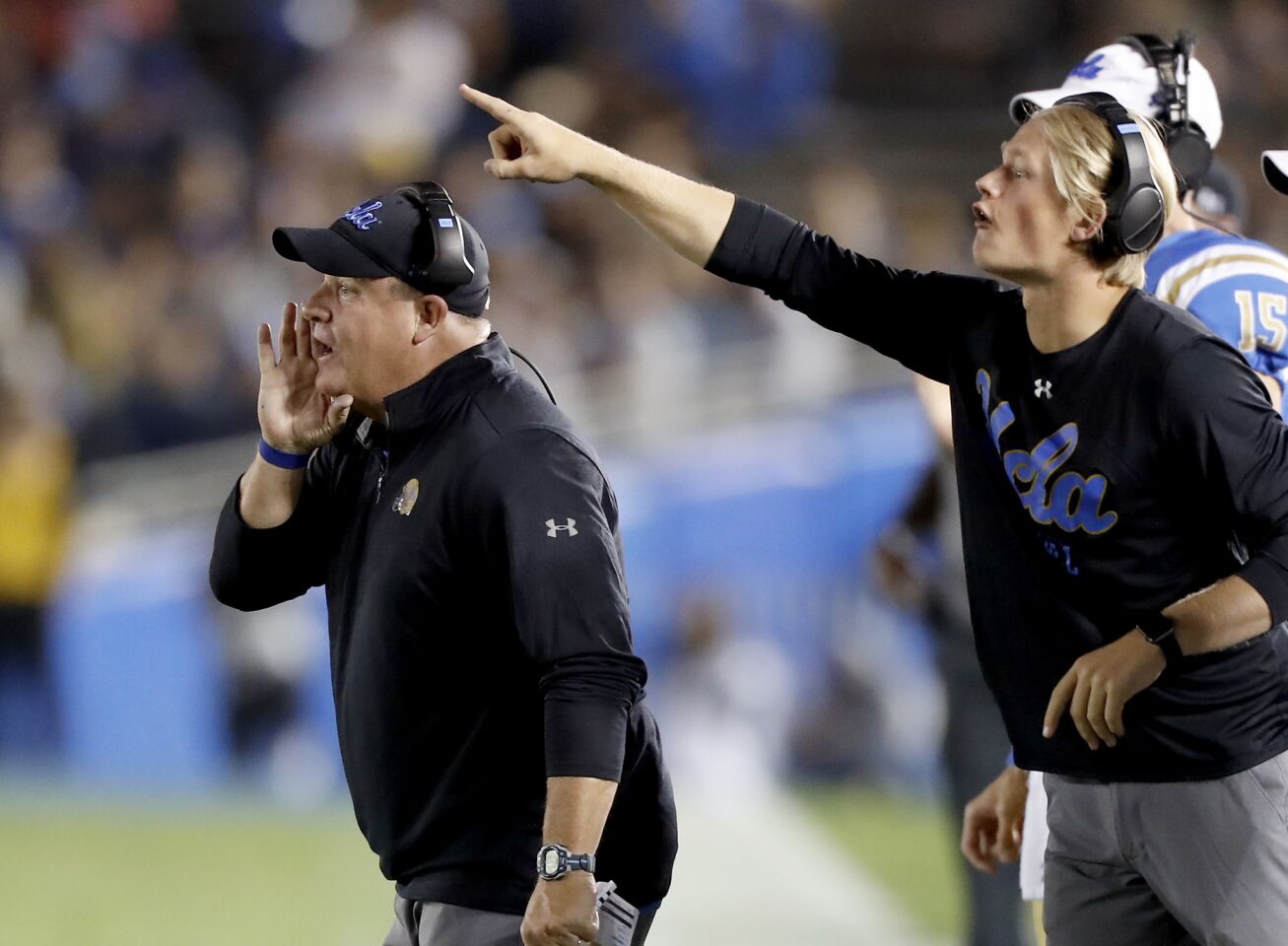 UCLA head coach Chip Kelly, left, shouts directions to his team in the fourth quarter on Saturday at the Rose Bowl.