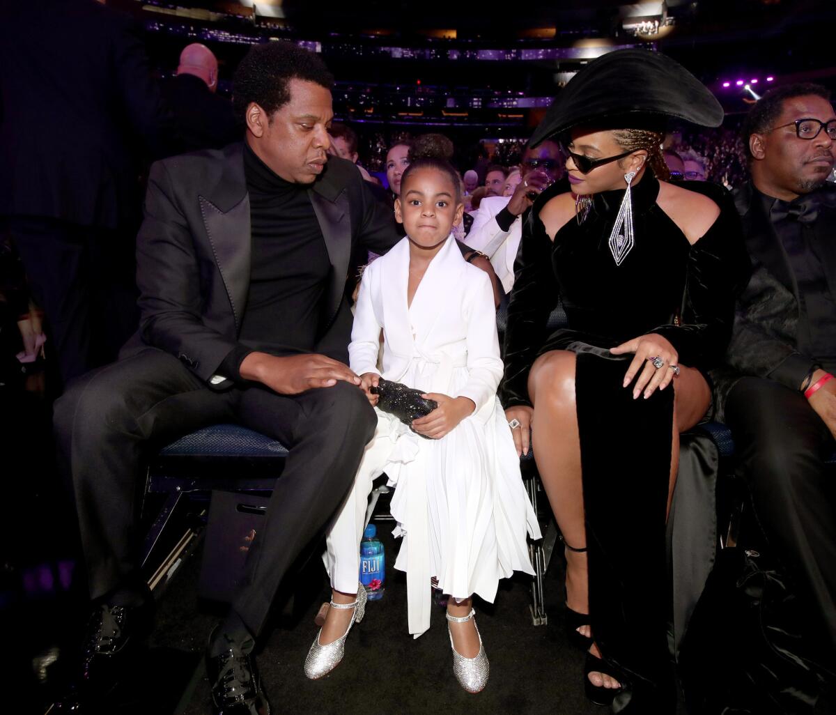 Jay-Z, left, Blue Ivy and Beyoncé attend the 60th Grammy Awards.