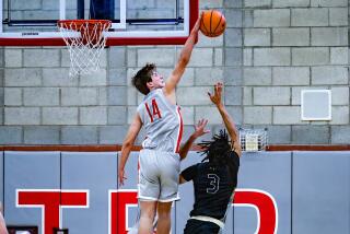 Mater Dei's Luke Barnett had 21 points, including a block against Elzie Harrington, in a 72-66 win against St. John Bosco. 