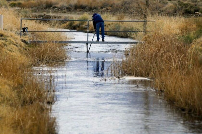 BISHOP, CALIFORNIA, MARCH 25, 2017: A DWP employee takes water readings on a tributary of the Owens River near Bishop, California March 25, 2017. With a season of record snowfall in the Sierras, the the Owens Valley is preparing for possible floods when everything starts melting (Mark Boster / Los Angeles Times ).