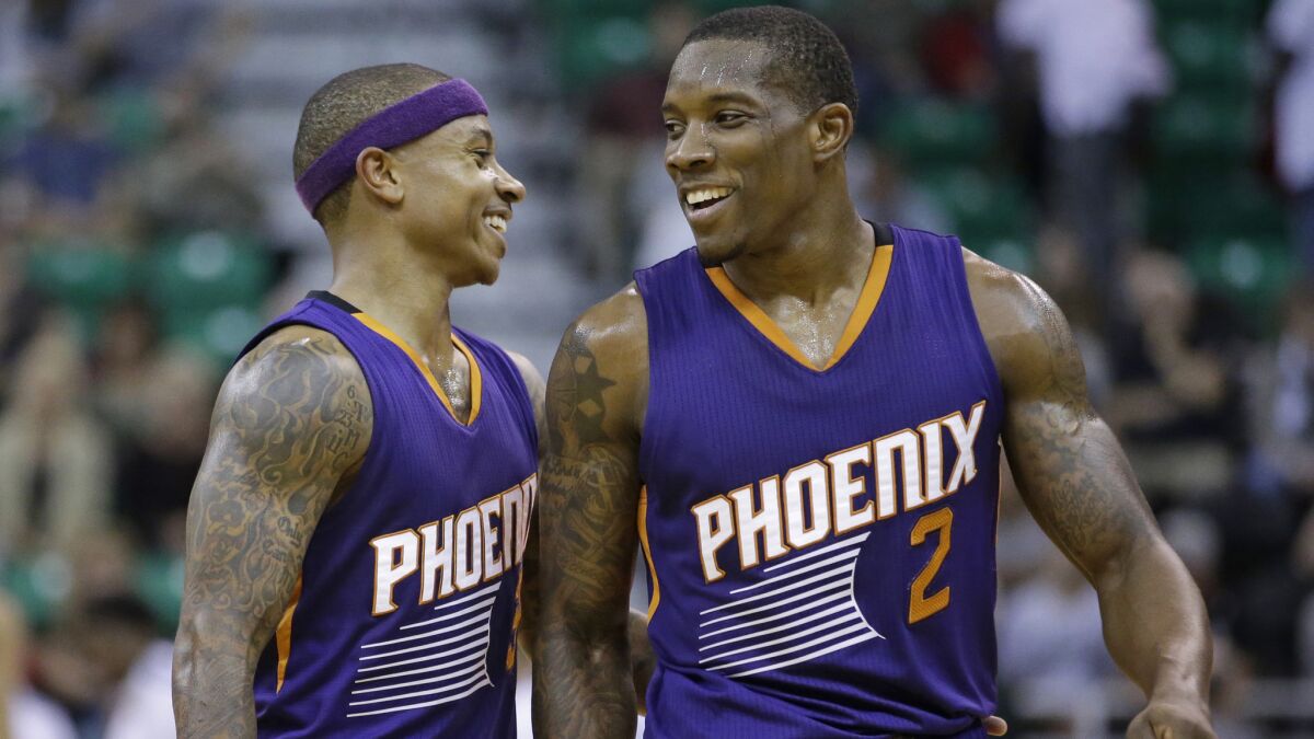 Phoenix Suns teammates Isaiah Thomas, left, and Eric Bledsoe smile during an exhibition game against the Utah Jazz on Oct. 24.