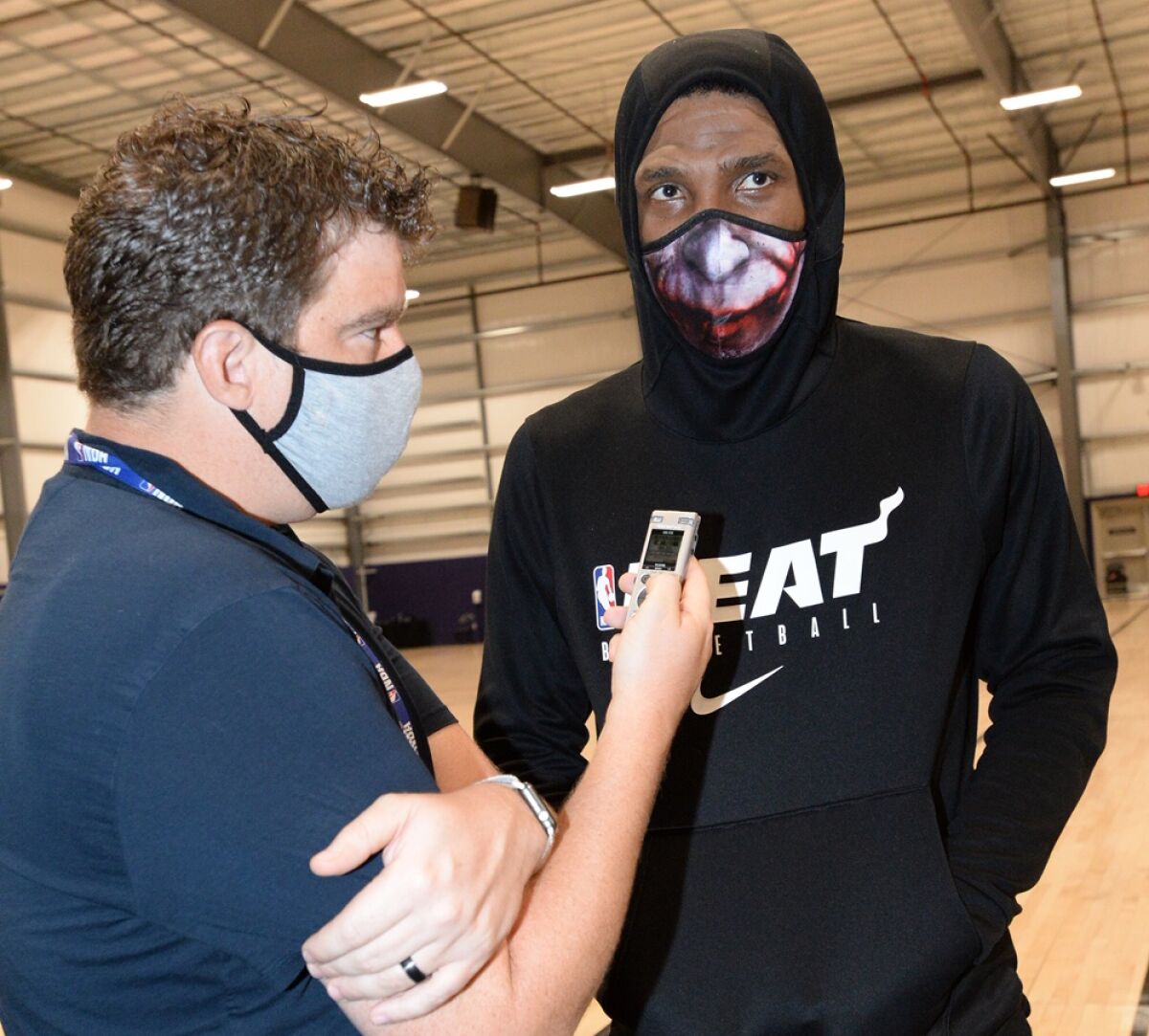 Times reporter Dan Woike interviews Heat veteran Udonis Haslem during a practice.