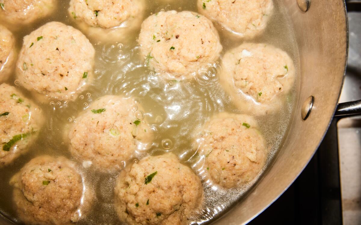 Matzo balls boil in a big pot