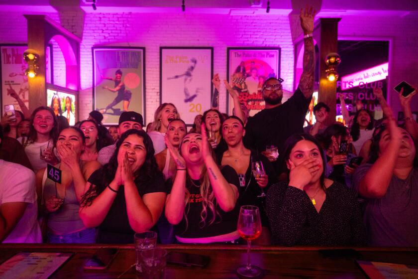 Los Angeles, CA - July 01: Fans of "Love Island USA" react to the show at a watch party at The Palm and Pine in Hollywood on Tuesday, July 1, 2025 in Los Angeles, CA. (Jason Armond / Los Angeles Times)
