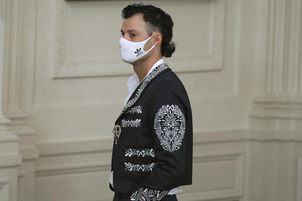 Dodgers pitcher Joe Kelly wears a mariachi jacket at the team's White House reception on  July 2, 2021, in Washington.