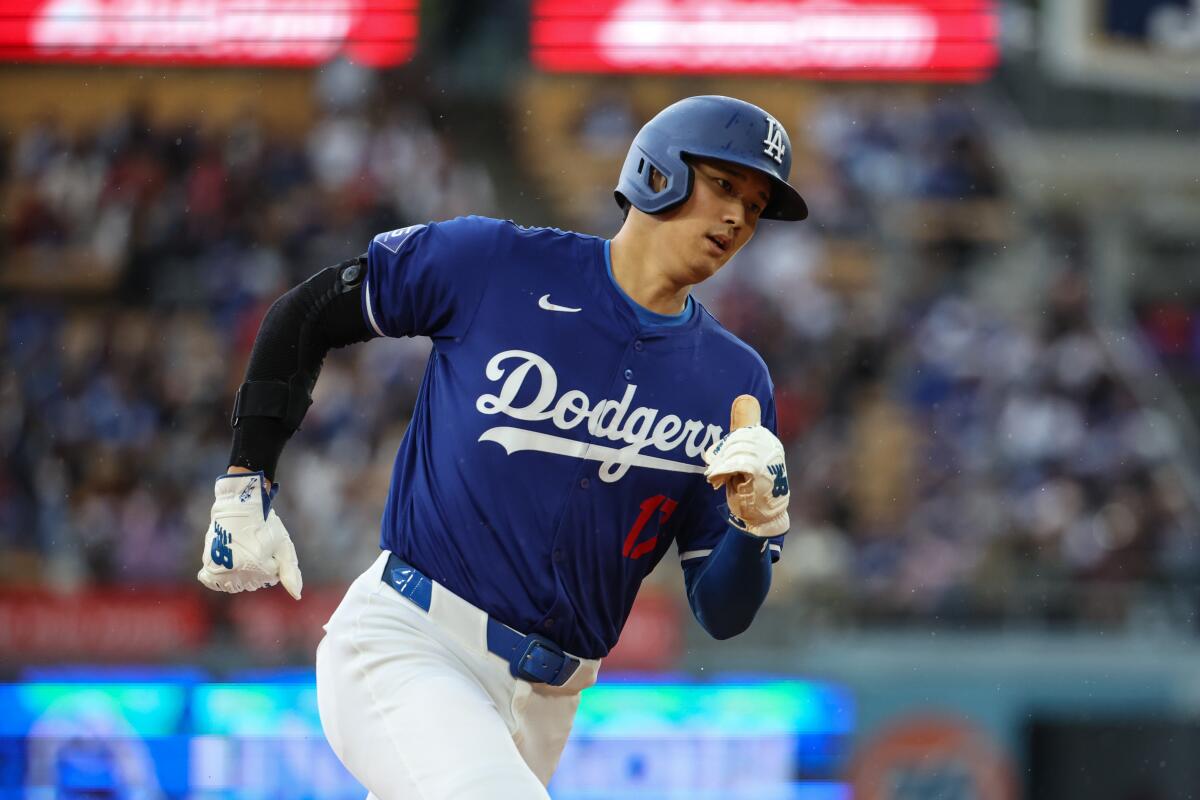 Dodgers designated hitter Shohei Ohtani runs the bases during a 5-3 win over the Angels.