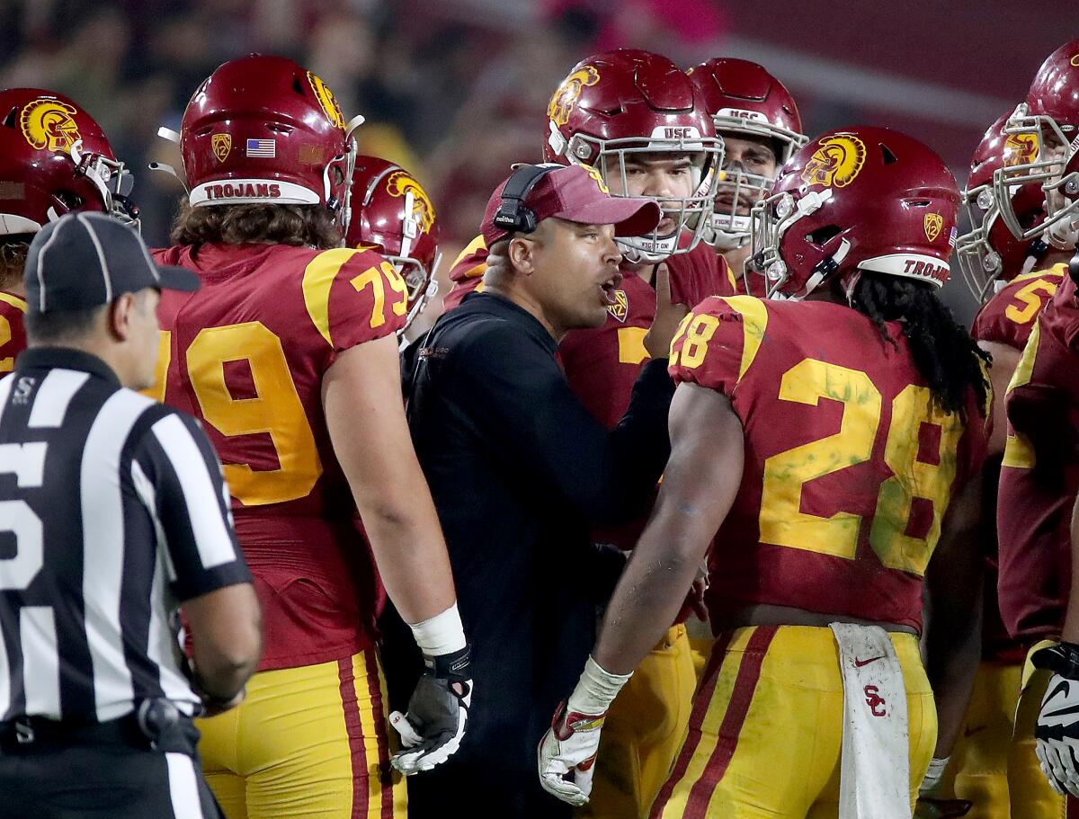 USC coach Donte Williams huddles with his players.