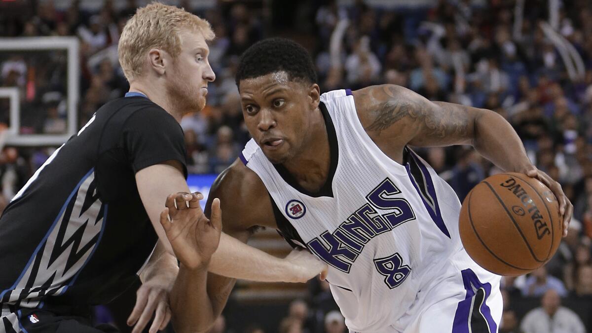 Sacramento Kings forward Rudy Gay, right, drives against Minnesota Timberwolves forward Chase Budinger during the Kings' 116-105 win in Sacramento on April 7.