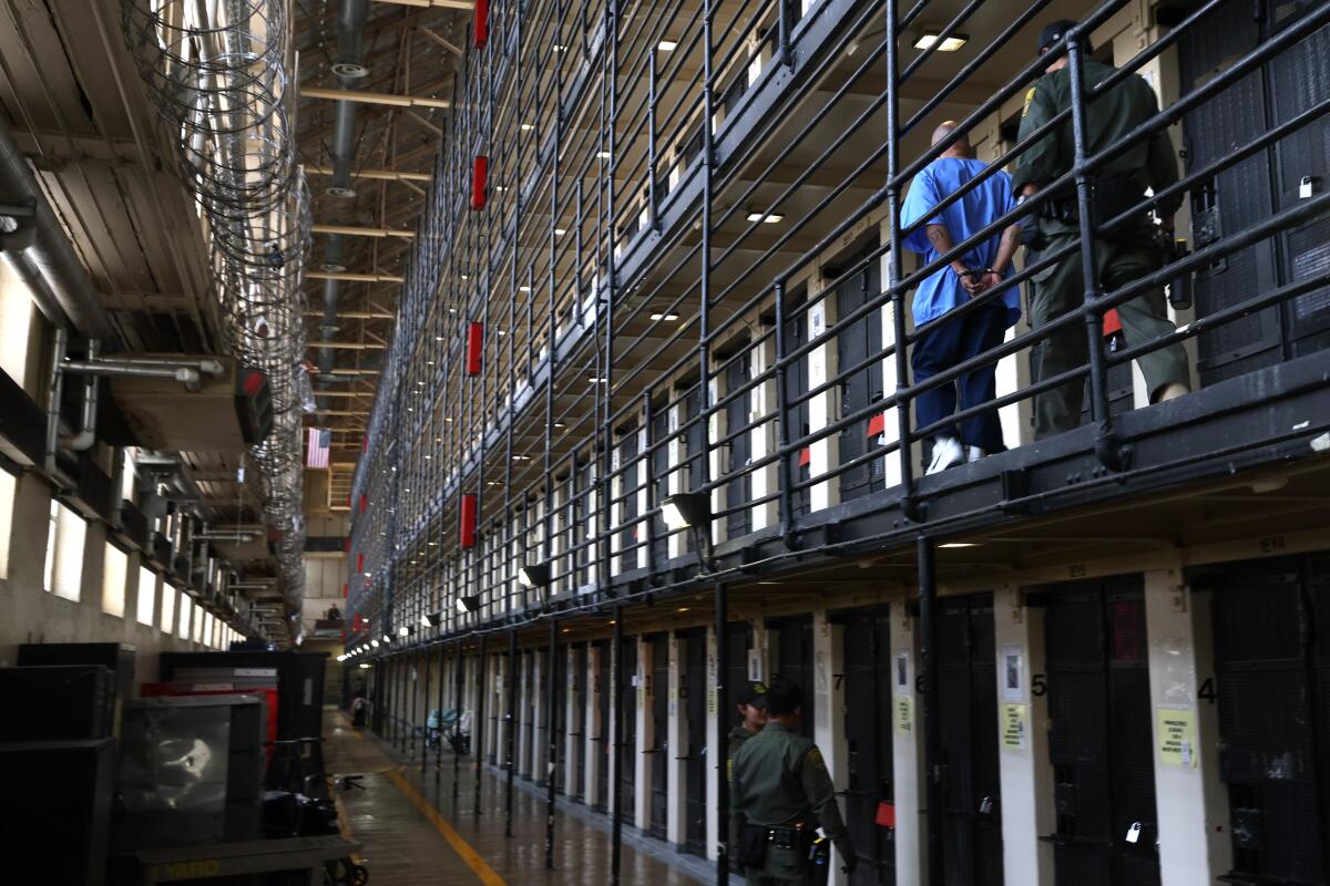 A condemned inmate is from his cell in San Quentin's Death Row. California