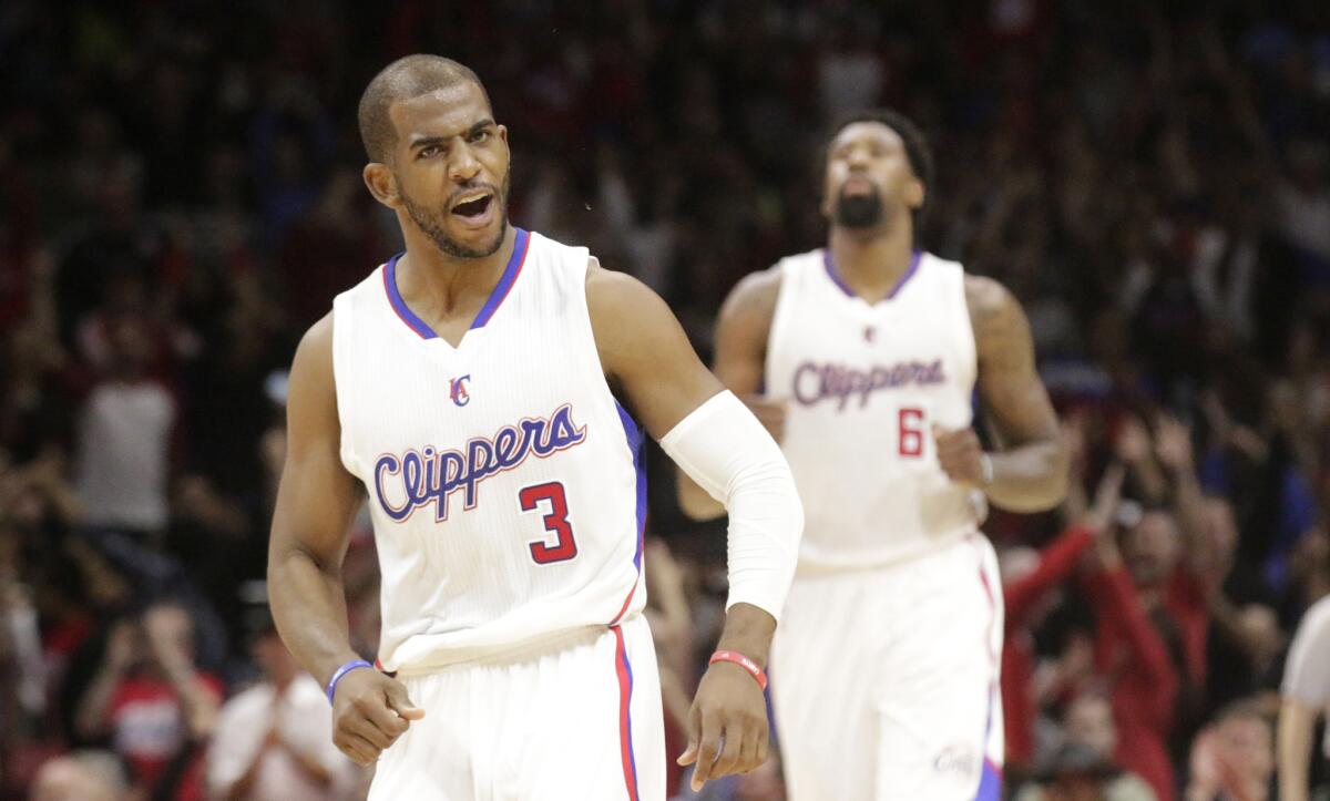 Clippers guard Chris Paul is happy with himself after hitting a three-pointer during the second half of a game against the Denver Nuggets on April 13.