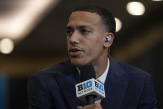 UCLA's Kobe Johnson speaks during the Big Ten men's NCAA college basketball media day.