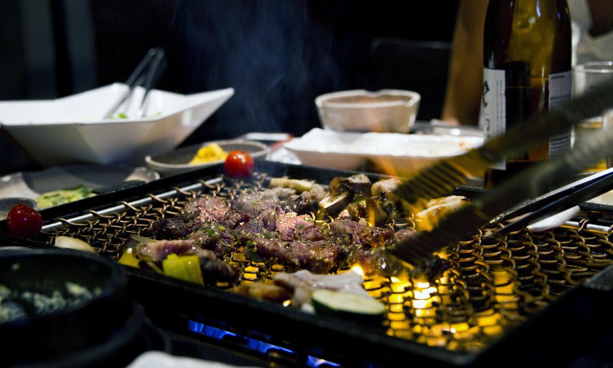 restaurant table with korean bbq grill