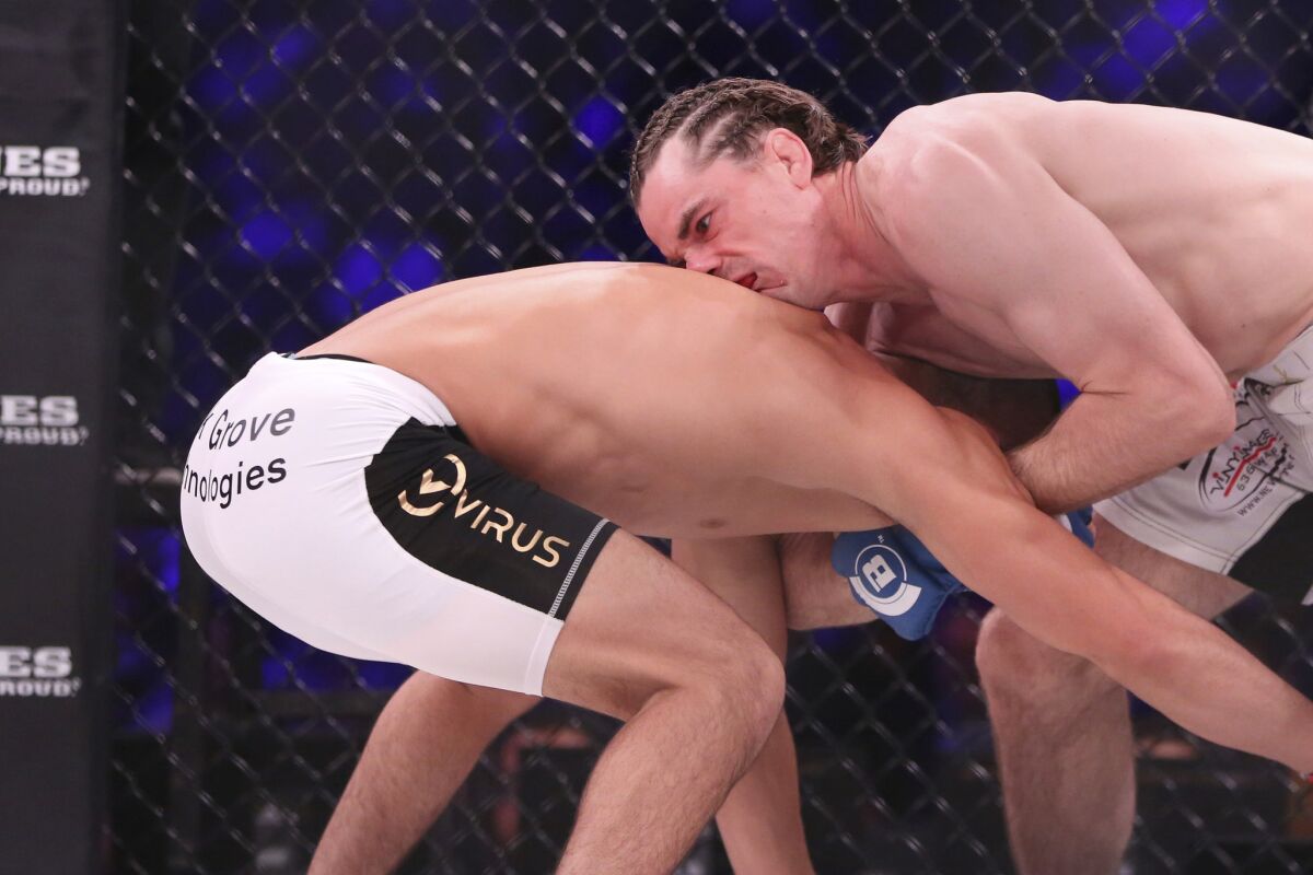 Zach Freeman, right, grapples with Aaron Pico before securing a choke during the bout at Bellator NYC.