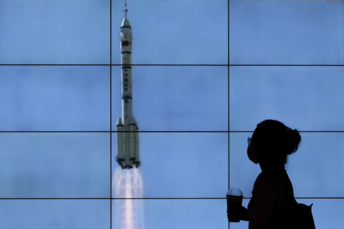 TV screen showing rocket launch