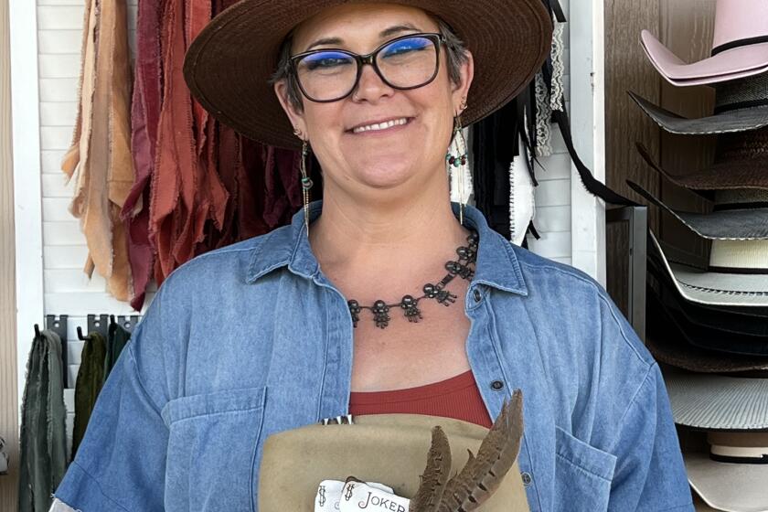 At her pop-up hat bar, Tara Holsapple displays nearly everything needed for customers who would like to make their own one-of-a-kind hats. Some finished hats are also available.