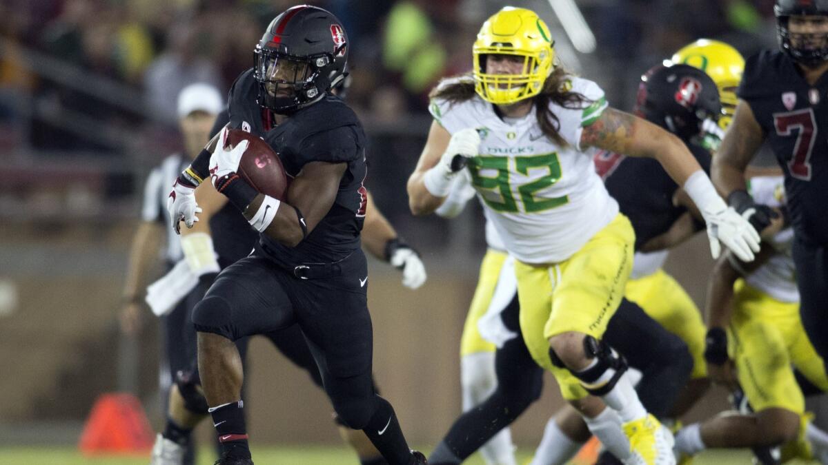 Stanford's Bryce Love (20) breaks free for a long touchdown against Oregon during the first quarter on Oct. 14, 2017 in Stanford. Love and the Cardinal will take on Oregon this Saturday in a top-25 showdown.