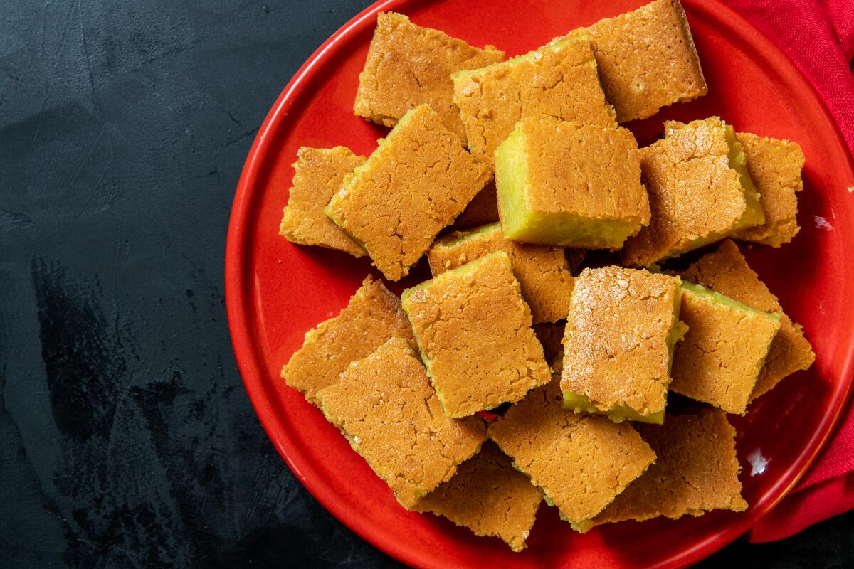 Butter mochi is crackly on top and sticky in the center when cut fresh out of the pan.
