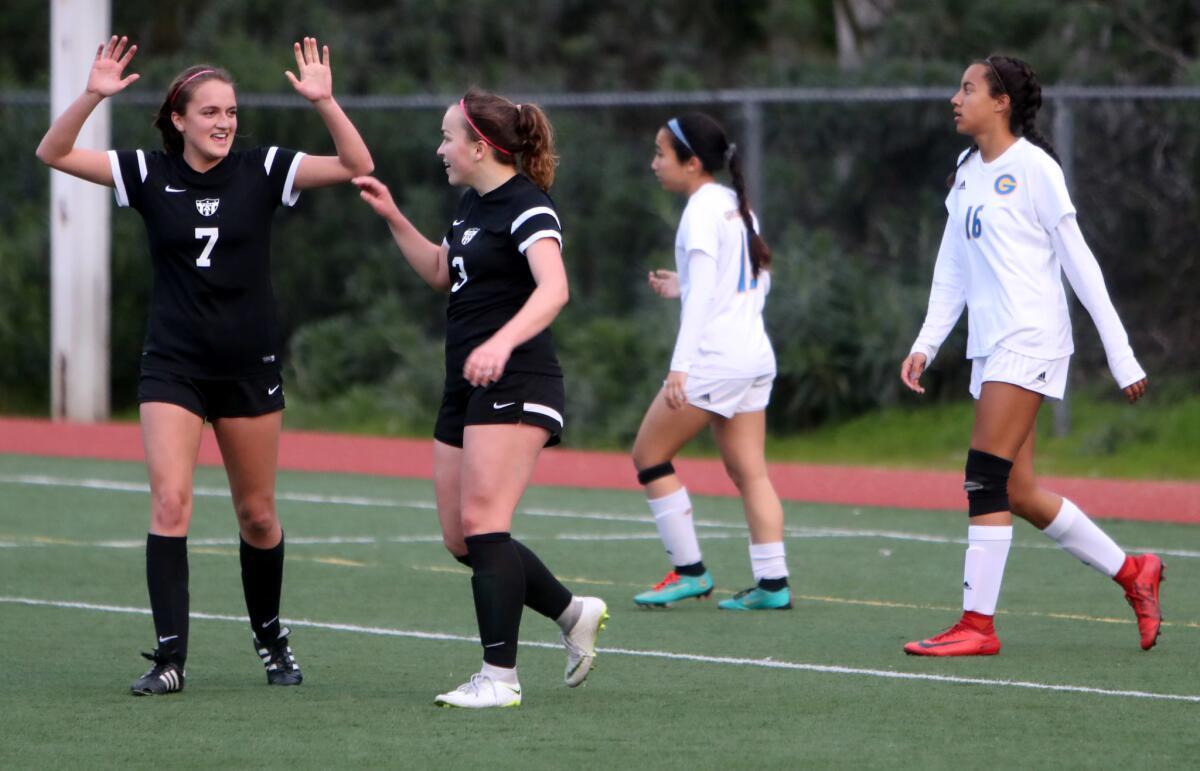 Flintridge Sacred Heart Academy soccer player #3 Jillian Willis celebrates scoring her first of two goals with #7 Hillary Howard, in CIF State Southern California Regional Division III semifinal match vs. Grossmont, at Glendale Sports Complex in Glendale on Thursday, Feb. 28, 2019. FSHA won 3-2.