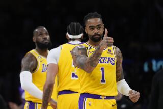 Los Angeles Lakers' D'Angelo Russell (1) reacts after a play during the first half in Game 4 of a first-round NBA basketball playoff series against the Memphis Grizzlies, Monday, April 24, 2023, in Los Angeles. (AP Photo/Jae C. Hong)