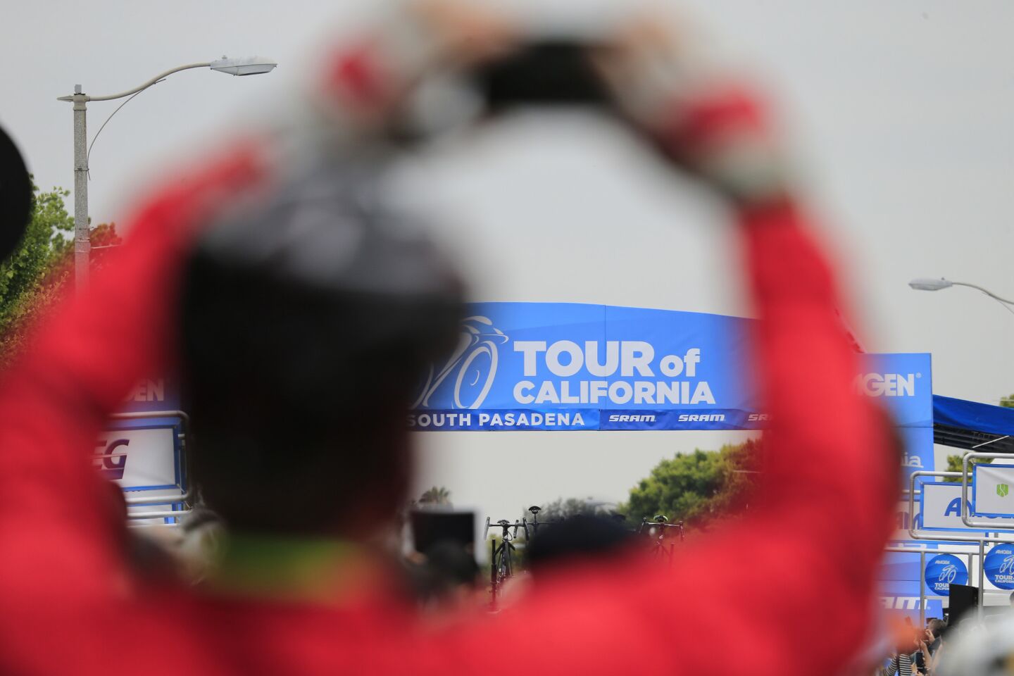 A fan takes photos as racers start the stage 2 ride of the Amgen Tour of California, from South Pasadena to Santa Clarita, on May 16.