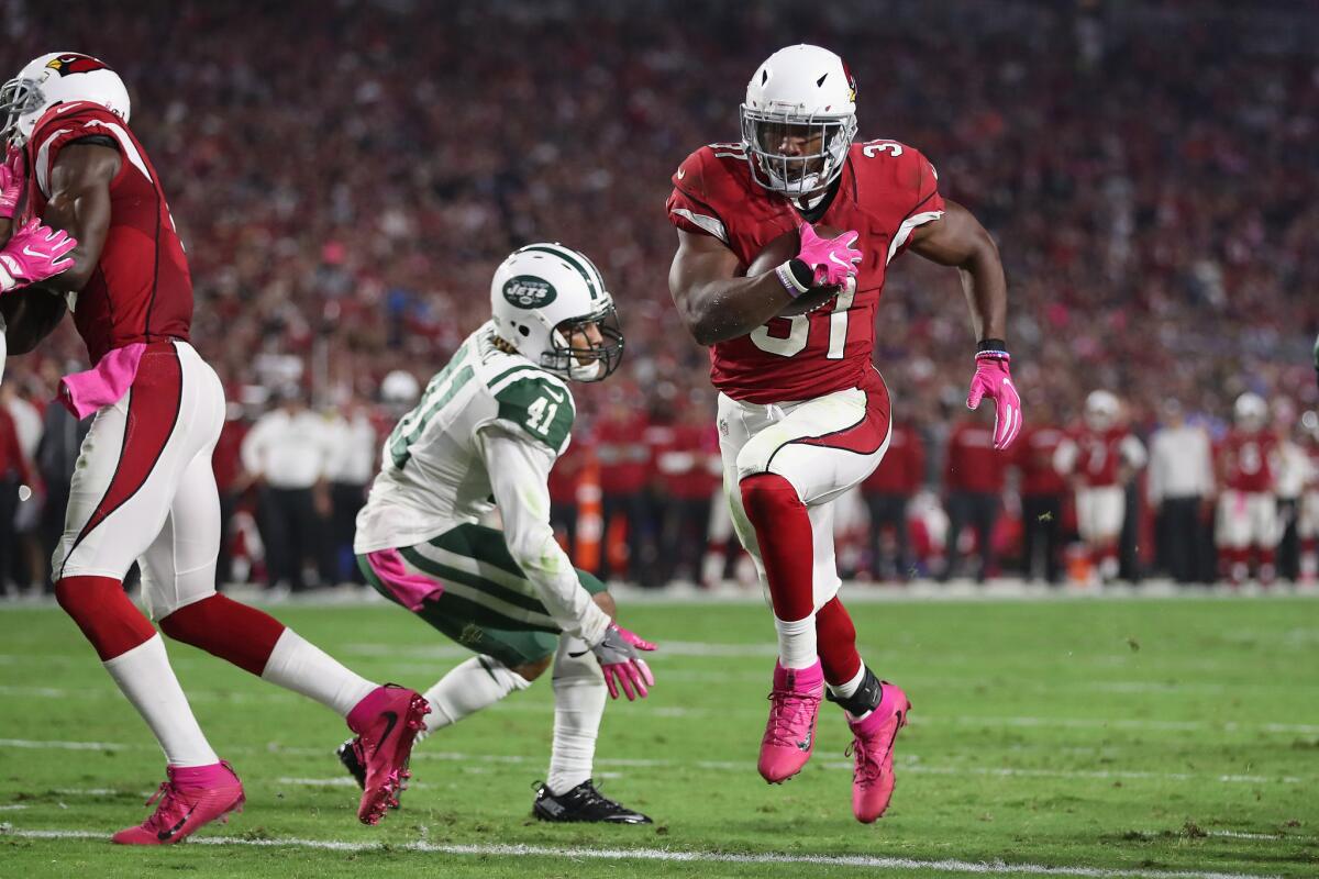 Cardinals running back David Johnson (31) rushes the football two yards for a touchdown against the New York Jets in the third quarter.