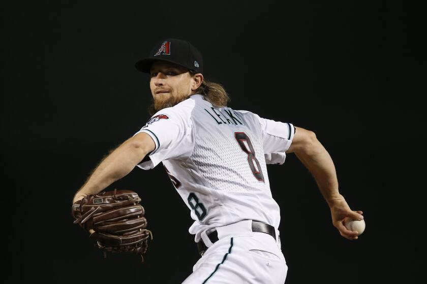 Arizona Diamondbacks starting pitcher Mike Leake warms up prior to a baseball game against the Cincinnati Reds Friday, Sept. 13, 2019, in Phoenix. (AP Photo/Ross D. Franklin)