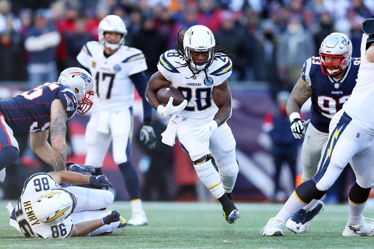 Chargers running back Melvin Gordon carries the ball against the New England Patriots in the playoffs last season.