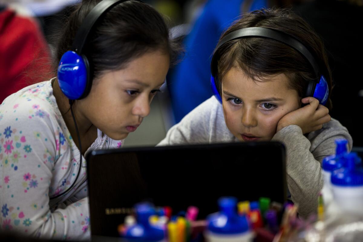 Esperanza Hernandez, left, and Teagan Garcia use Chromebooks in Joanie Bryant's class at Waggoner Elementary School in Winters.
