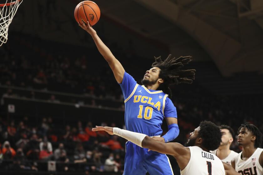 UCLA guard Tyger Campbell (10) drives to the basket past Oregon State forward Maurice Calloo.