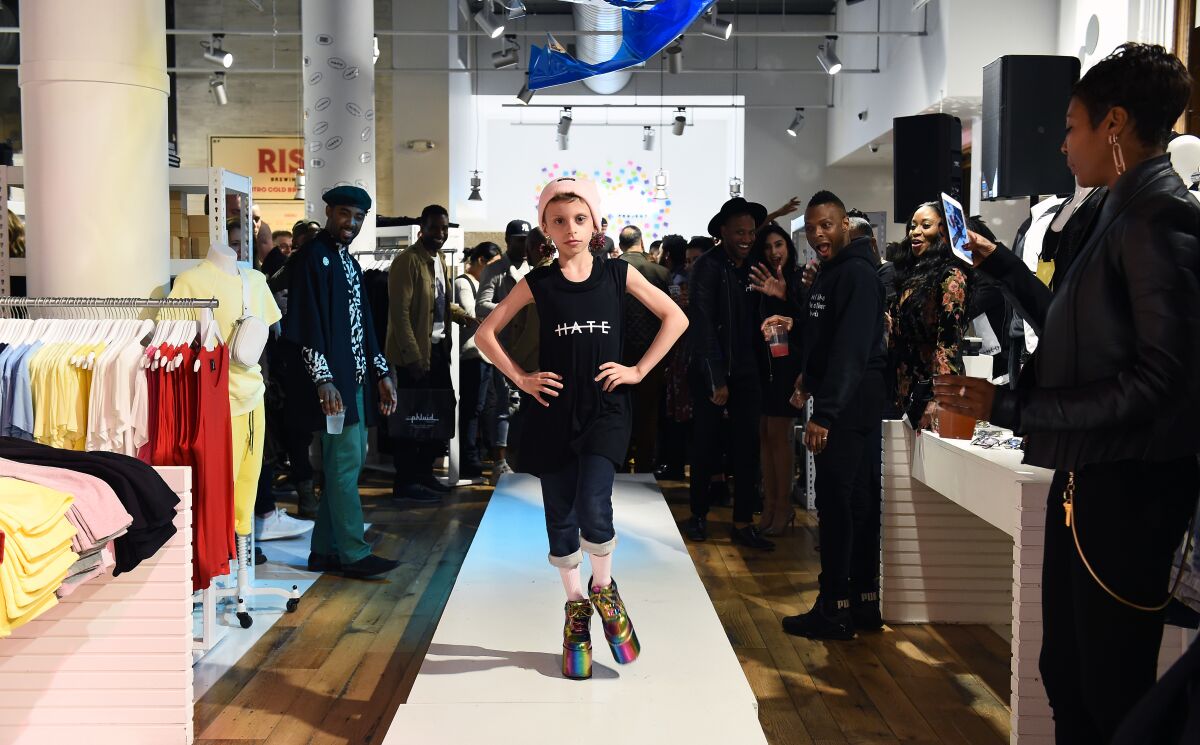 Desmond Is Amazing, self-described drag kid, walks a runway in April 2018 at the Phluid Project, a gender-neutral clothing store in New York City.