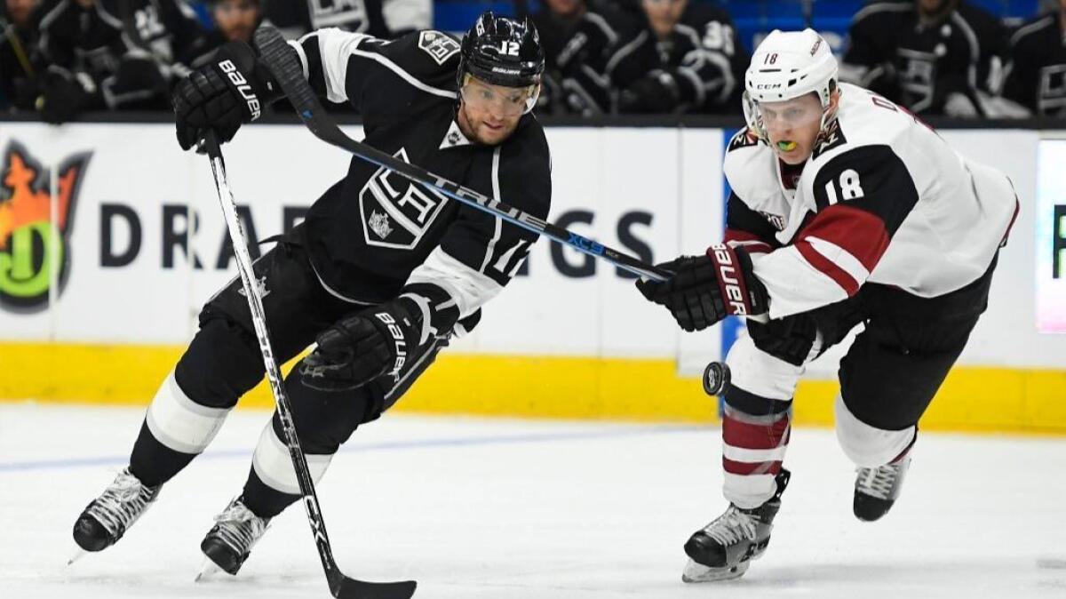 Kings right wing Marian Gaborik and Coyotes center Christian Dvorak vie for the puck during the second period on Feb. 16.