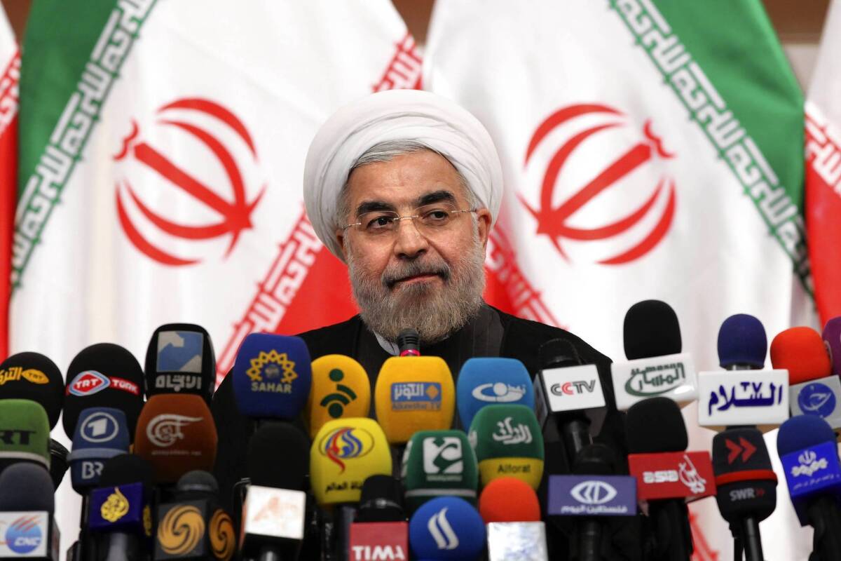 Iranian President-elect Hassan Rowhani holds a news conference in Tehran.