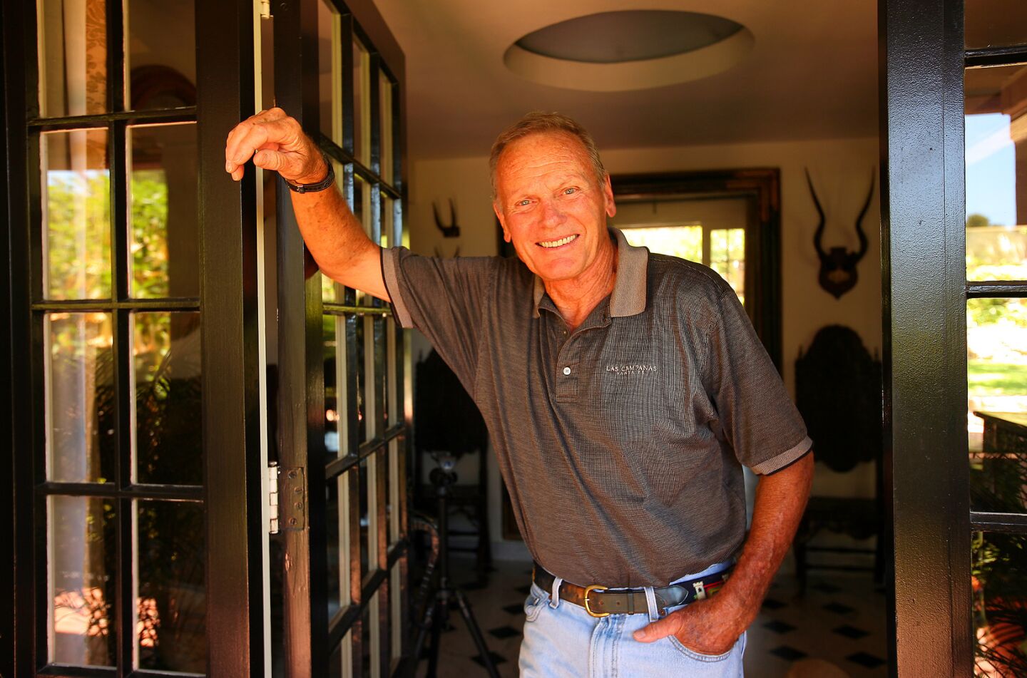 Actor Tab Hunter at the front door of his house in Montecito.