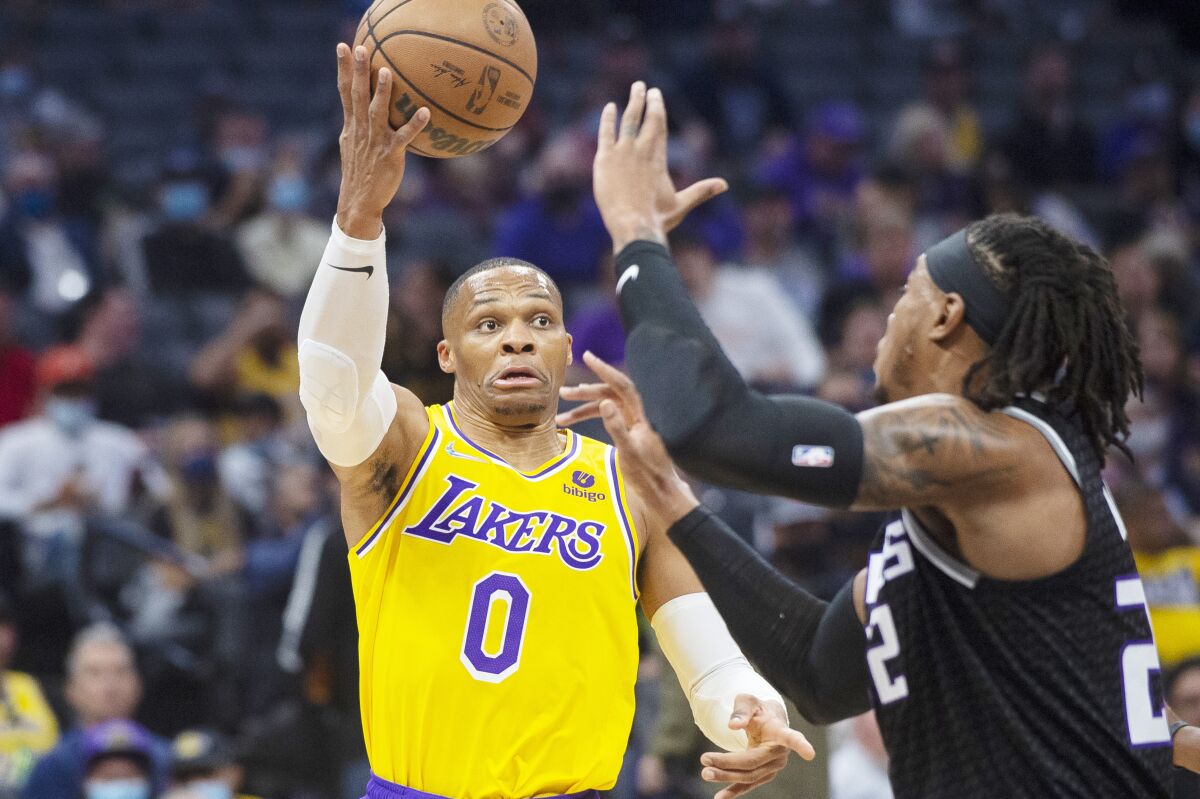 Los Angeles Lakers guard Russell Westbrook passes the ball over Sacramento Kings center Richaun Holmes