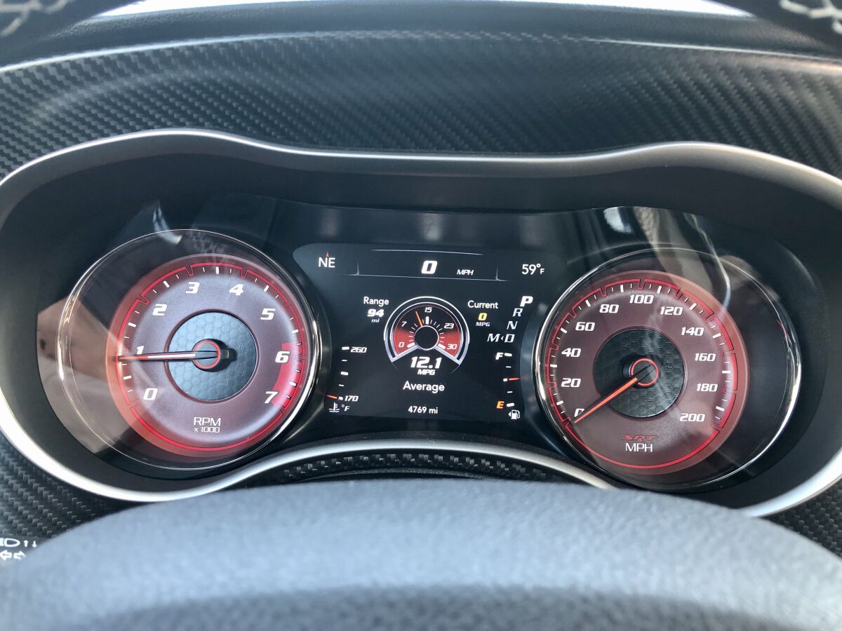 The 200-mph speedo and better than average fuel economy at 12.1 mpg city on the required premium.