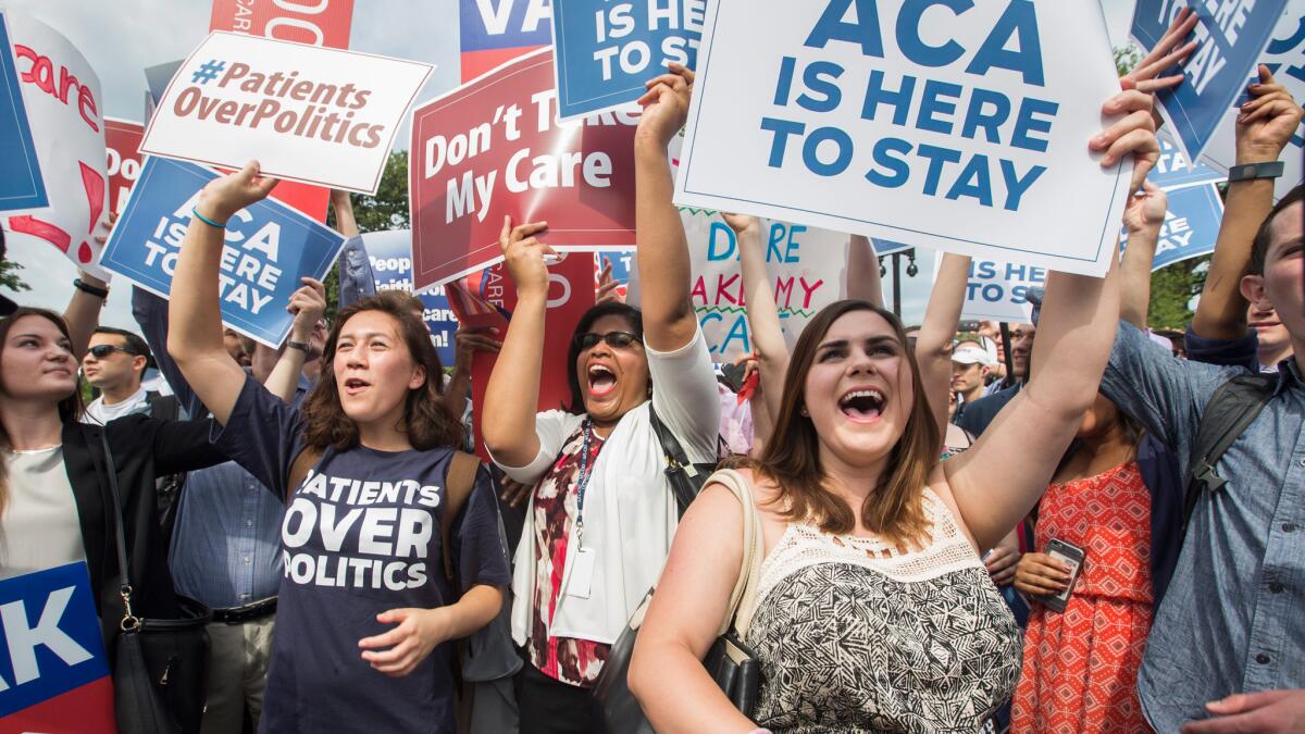 Obamacare supporters rally at the U.S. Supreme Court in 2015 after a court ruling upheld a key element of the healthcare law.