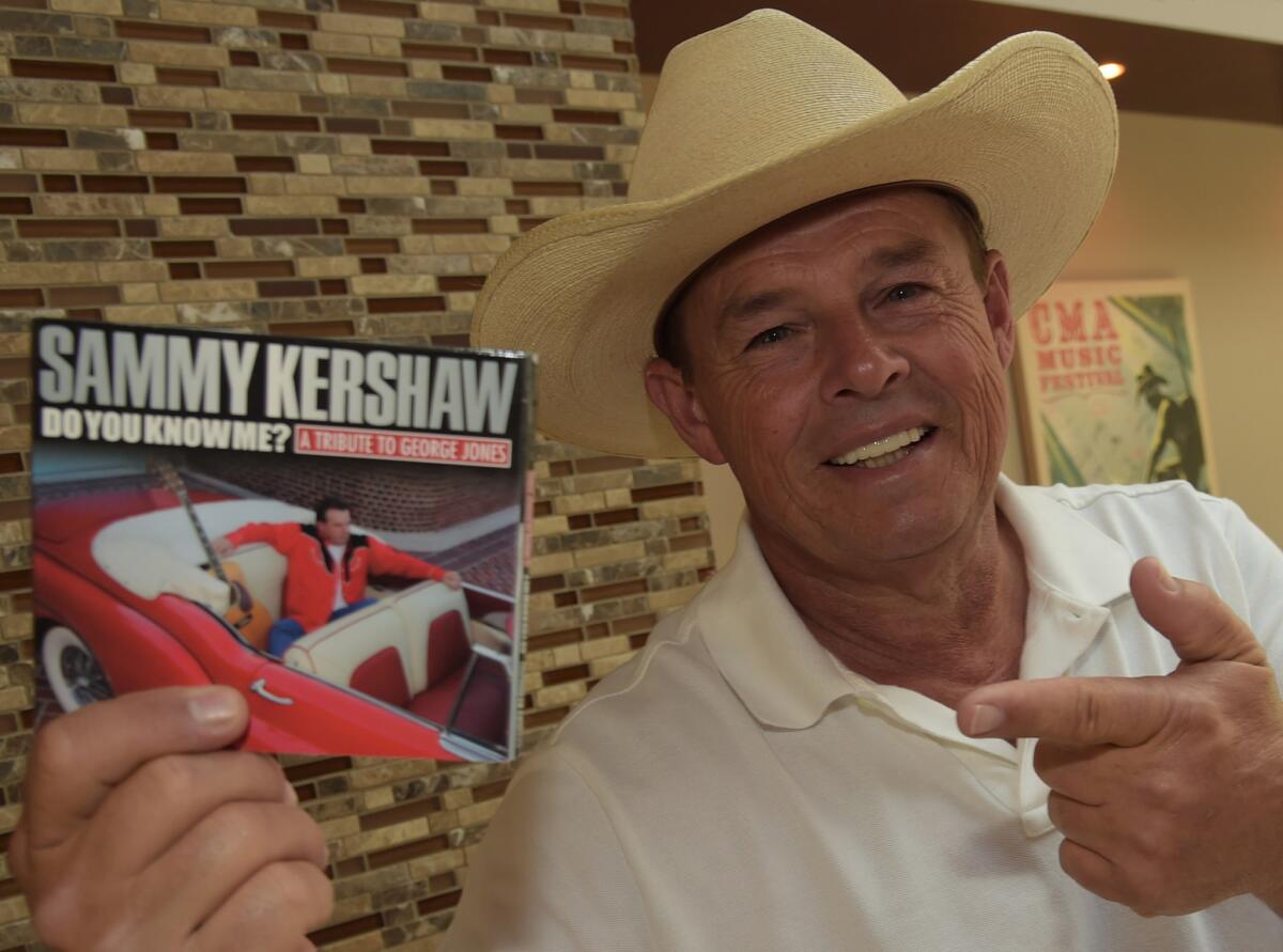 Sammy Kershaw holds his album "Do You Know Me? A Tribute to George Jones."