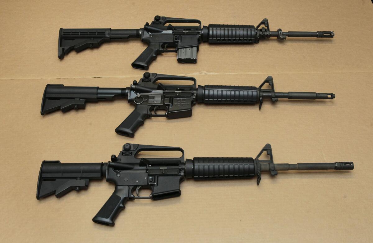 Three variations of the AR-15 assault rifle are displayed at the California Department of Justice in Sacramento.