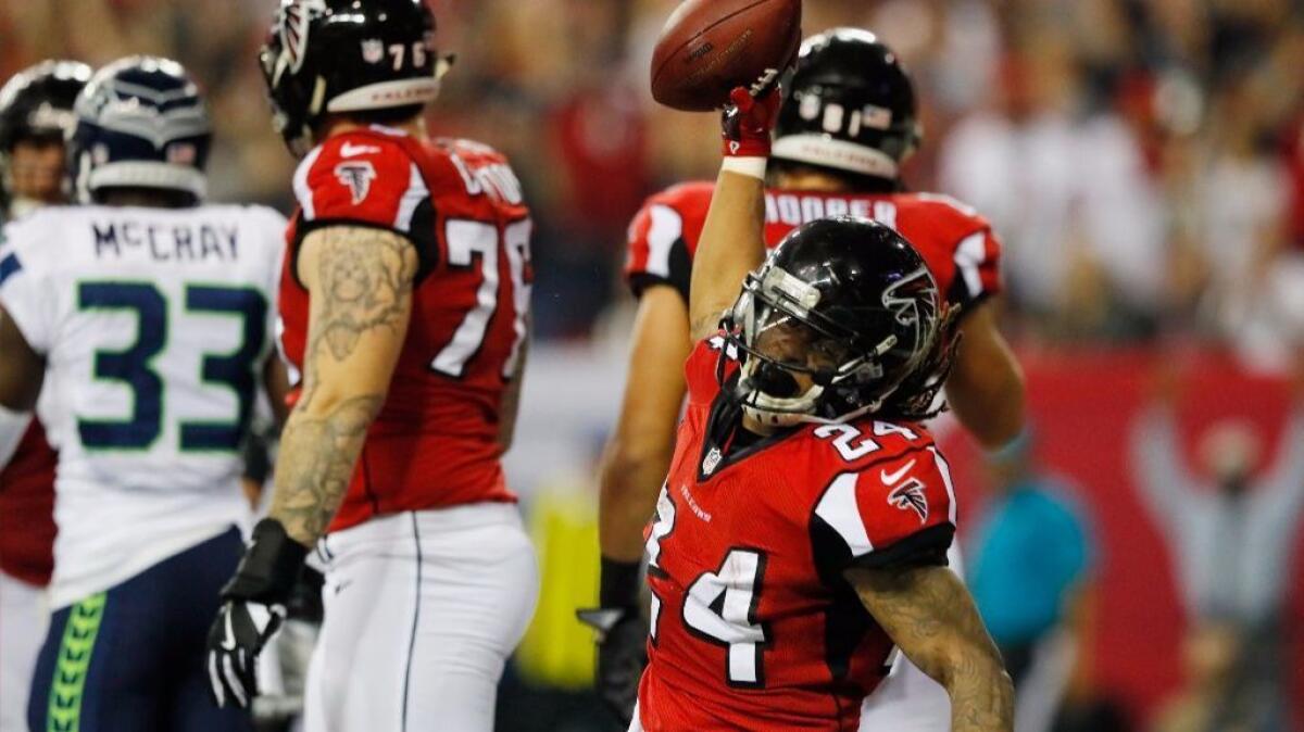 Falcons running back Devonta Freeman celebrates during Atlanta's NFC playoff victory over the Seattle Seahawks on Jan. 14.