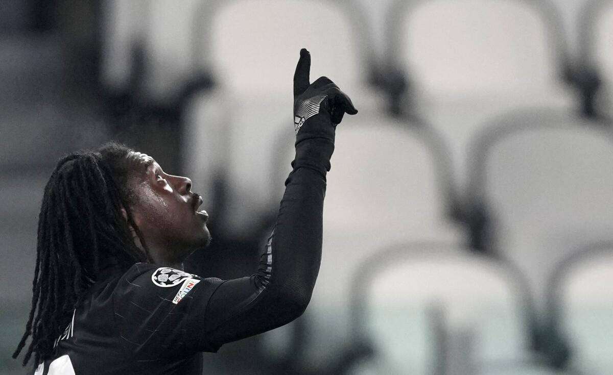 Juventus' Moise Kean celebrates after scoring his side's opening goal during the Champions League group H soccer match between Juventus and Malmo at the Allianz stadium in Turin, Italy, Wednesday, Dec. 8, 2021. (AP Photo/Antonio Calanni)