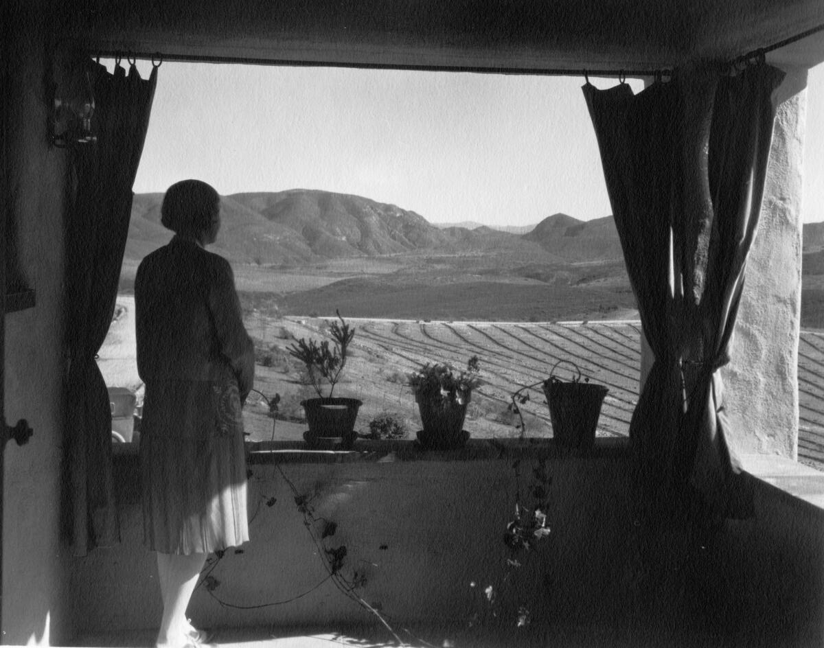Lilian Rice looking across valley over Rancho Santa Fe in about 1926.