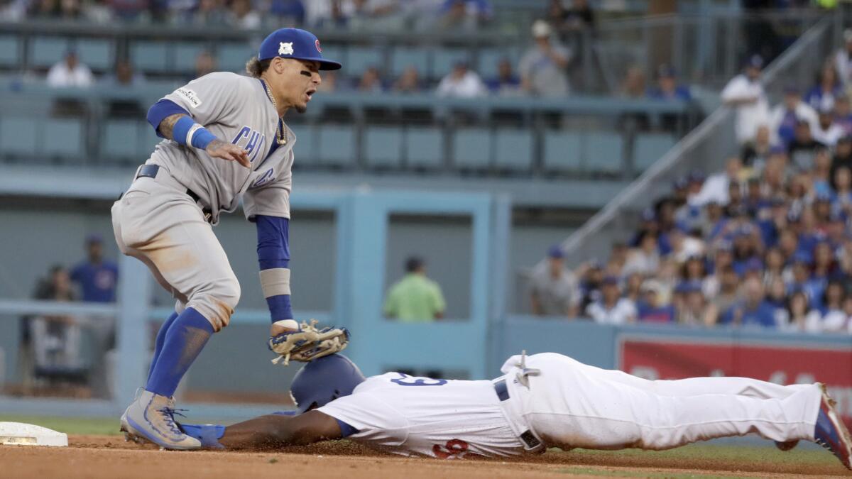 Yasiel Puig is tagged out by Cubs second baseman Javier Baez.