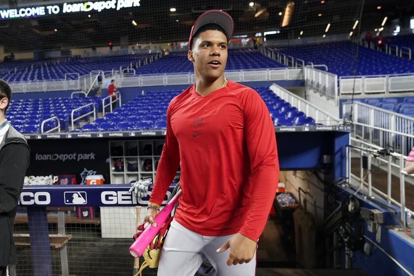 Washington Nationals right fielder Juan Soto walks from the dugout before a baseball game against the Miami Marlins, Monday, May 16, 2022, in Miami. The Marlins won 8-2. (AP Photo/Lynne Sladky)